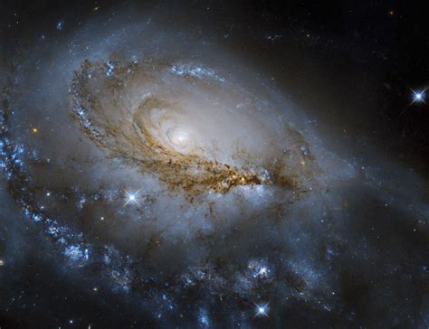 Hubble Sees A Spiral Galaxy With A Supermassive Black Hole Feasting At