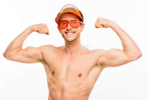 Closeup Of Attractive Young Man Flexing Bicep Muscles On White B Stock