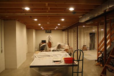 In basement playrooms designed for rambunctious kids, elaborate or delicate light fixtures typically aren't the best idea. Basement Upgrade: Creating the new hangout… - Runlevel-6