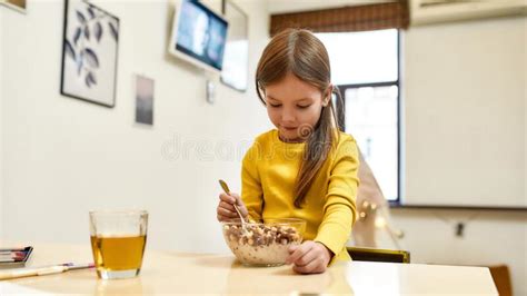 Start Of The Day Caucasian Cute Little Girl Going To Eat Cereal Balls