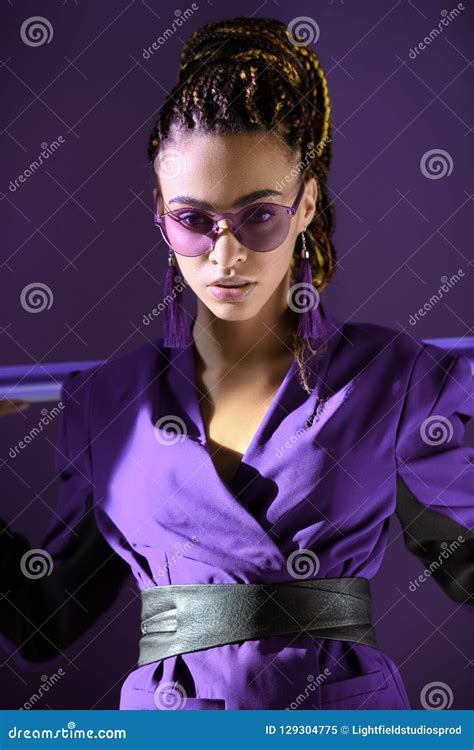 Stylish Mulatto Girl Posing In Ultra Violet Jacket And Sunglasses Stock