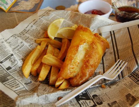 chips fish food british zealand britain traditional fried delicacy cuisine chippy paper chip acquired uprising taste global dish culture wrapped