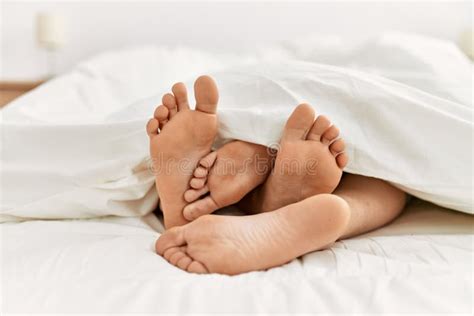 Couple Feet Under Sheets On The Bed At Home Stock Image Image Of Duvet Pajama 248921907
