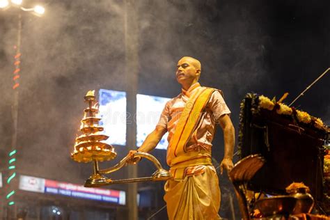 Portrait Of Hindu Male Priest Performing Ganga Aarti In Varanasi