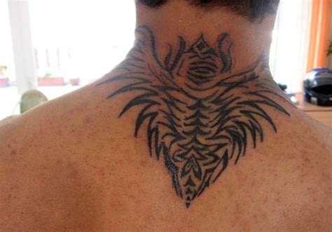 The bold lines and the stylish patterns used on the tattoo makes it look elegant. 59 Wonderful Wings Neck Tattoos