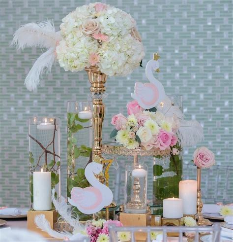 The Table Is Set With Candles Flowers And Decorative Items For An