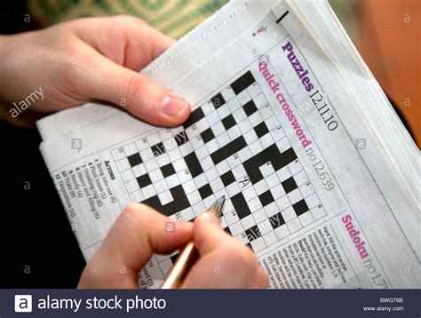 Welcome to washington post crosswords! Solving A Quick Newspaper Crossword, London Stock Photo ...