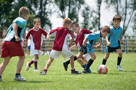 Kids Playing Football Stock Photo By ©fotokostic 20997099