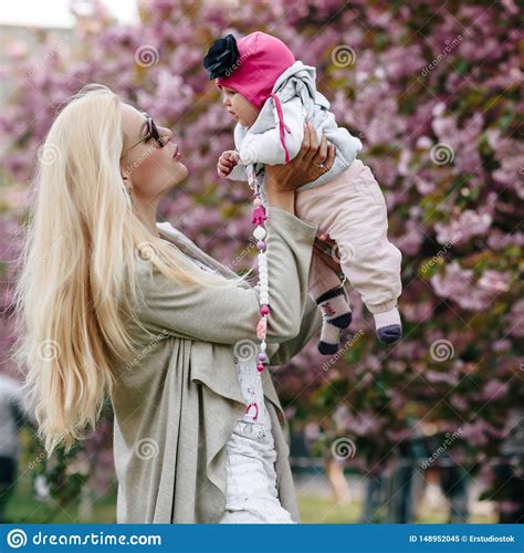 Beautiful Young Mother Walks With A Small Daughter Stock Image Image