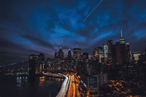 Download Time Lapse Bridge Skyscraper Meteor Light Night City Man Made