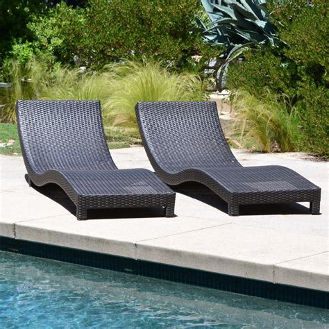 Stretch out, relax and soak up the sun with new patio lounge chairs. Coast Modern Living Outdoor Chaise Lounge Chairs w/ Cushions