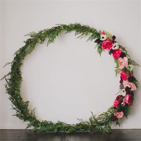 Filled with artificial flowers and greenery, this ceremony arch is easily made long before. DIY Giant Circle Arch | Diy wedding flowers, Wedding ...