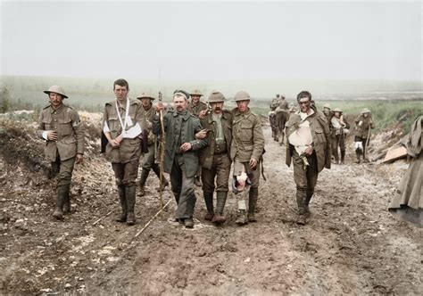 A German Pow Helps British Walking Wounded During The Battle Of The