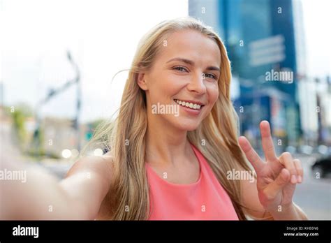 Happy Young Woman Taking Selfie On City Street Stock Photo Alamy