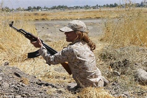 a kurdish peshmerga female fighter takes up a position during combat skills training befor