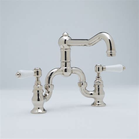 Without a great kitchen faucet, the kitchen sink fails us. Rohl 3 Leg Bridge Country Kitchen Faucet With Sidespray