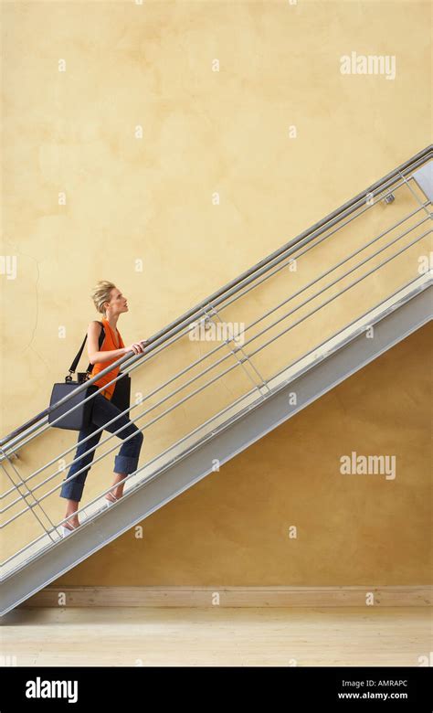 Blond Woman Walking Up Stairs Hi Res Stock Photography And Images Alamy