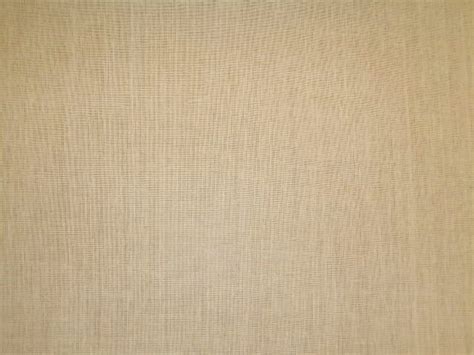 Linen is a pale tan colour in its natural state. Laura & Kiran pattern Craftsman Linen color Antique Ivory