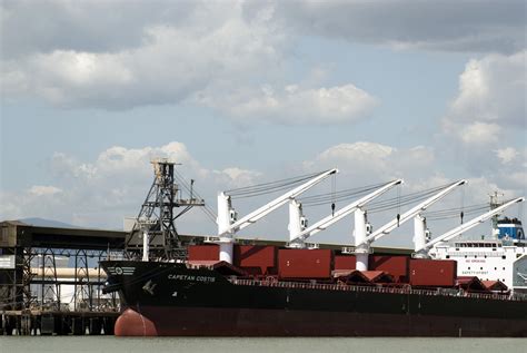 Free Image Of Cranes For Loading Cargo On A Bulk Carrier Freebie