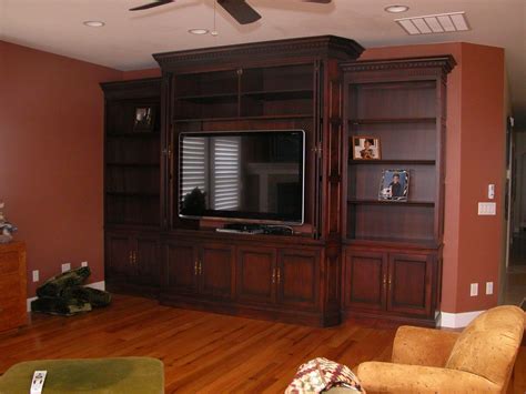 Pocket systems can be implemented as double or single door applications. TV Media Cabinetry | Unique Design Cabinet Co