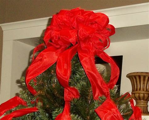 Christmas bow making for the holidays. Red Christmas Tree Topper Bow with Streamers Large Tree
