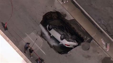 CHECK IT OUT Sinkhole Swallows Up Car In Downtown St Louis No Injuries