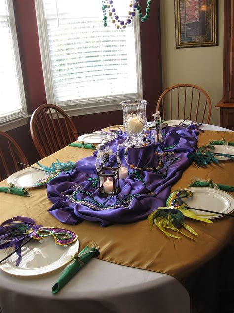 Think purple, green, and gold. A Mardi gras themed table (like the purple fabric idea ...