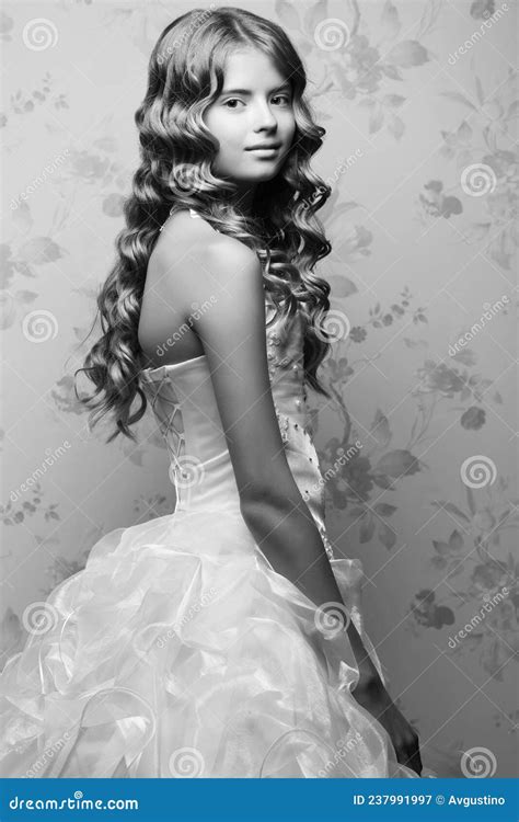 Portrait Of A Little Princess In White Vapory Classic Dress With Pearls