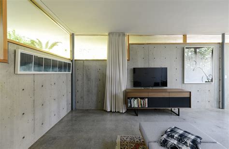 Ten Living Rooms That Use Concrete To Create Textural Interest