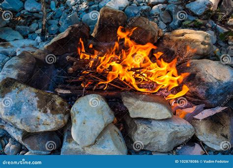 Campfire Surrounded By Rocks Stock Photo Image Of Blaze Flame 102878086