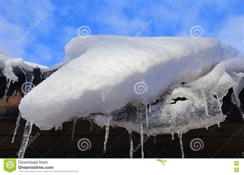 Icicles And Snow On The Roof In Sunny Winter Day Stock Photo Image