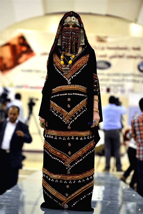 A Model Presents Traditional Yemeni Clothes In A Fashion Show Held In Sanaa