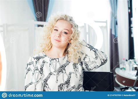 The Beautiful Blonde Admires Her Hair In A Beauty Salon Stock Image Image Of Luxury Female