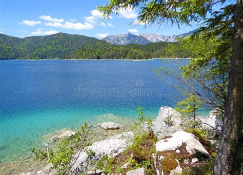 Picturesque Turquois Alpine Lake Eibsee By Foot Of Mountain Zugspitze