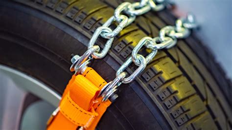 How to Put on Snow Chains on Your Tires: DIY Steps | The Drive