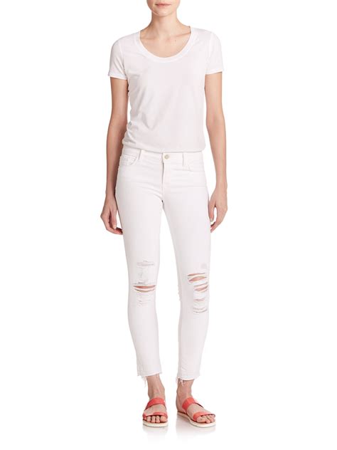 J Brand Distressed Low Rise Cropped Skinny Jeansdemented In White