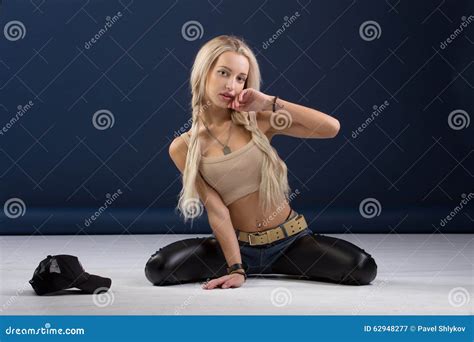 Attractive Blond Woman Sitting On Her Knees Stock Image Image Of Fashionable Music 62948277