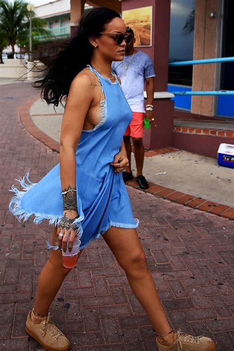 rihanna street style in barbados ripped denim dress and round sunglasses outfit rihanna looks