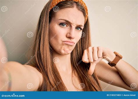 Young Beautiful Redhead Woman Wearing Diadem Make Selfie By The Camera With Angry Face Negative