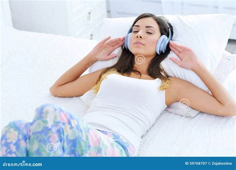 Relaxed Young Woman Listening To Music In Headphones Stock Image