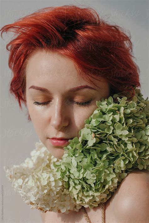 Daydreaming Redhead Woman With Floral Collar By Stocksy Contributor Liliya Rodnikova Stocksy