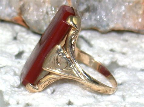 The grade of gold can range from 10k to 18k. Vintage 10K Gold Carnelian Ring from emilysattictreasures on Ruby Lane