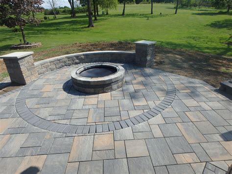 Paver patio with charcoal circle inlay and matching charcoal accent