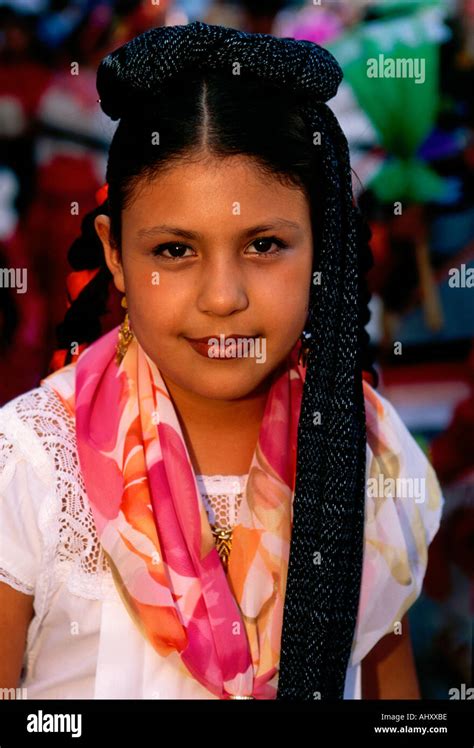 1 one mexican girl costumed dancer eye contact front view portrait guelaguetza festival