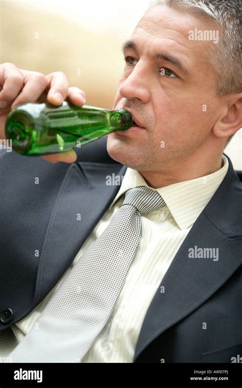 Businessman Drinking Bottled Mineral Water Stock Photo Alamy