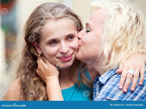 Happy Mother Kissing Her Daughter Stock Photo Image Of Face Aged
