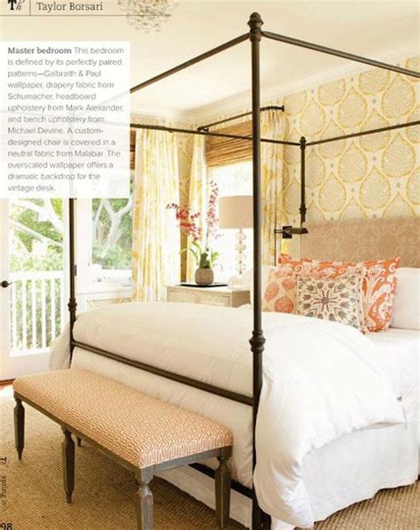 She instantly fell in love. iron canopy bed paired with wallpaper behind | Home ...