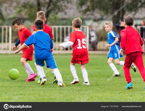 Young Children Players Football Match On Soccer Field Stock Photo By