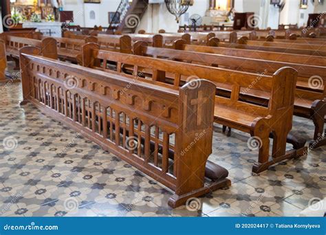 Bench In The Catholic Church Old Wooden Benches In The Cathedral Stock