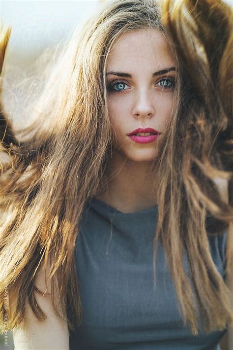 Beautiful Young Woman With Blue Eyes With Wind In Hair By Jovana Rikalo